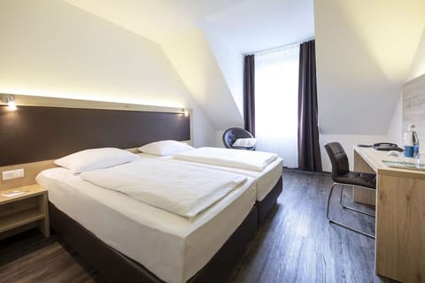 Wake up to soft daylight in a calm, airy room.