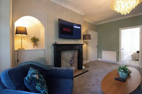 The spacious living room combines modern style with everyday comfort, creating the perfect place to gather and make yourself at home.