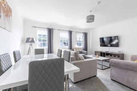 Spacious living room filled with abundant sunlight for a bright and welcoming atmosphere.