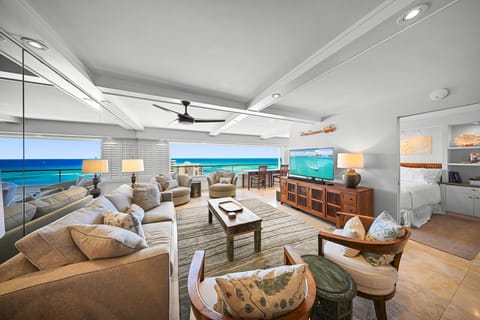 From the living room, enjoy partial Pacific views while unwinding after a day exploring Honolulu's Gold Coast.
