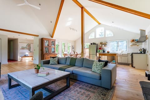 Gather together in the bright, open-concept great room with soaring vaulted ceilings and plenty of space to relax