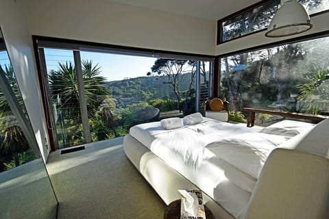 Generous windows fill each bedroom with natural light and uninterrupted views of the surrounding landscape.