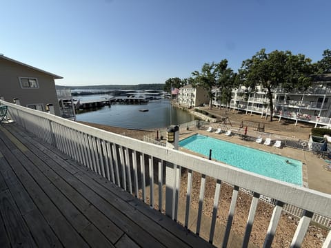 View from outside the front door overlooking the community pool and the lake