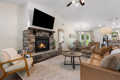 Our warm and inviting living room features a stylish, comfortable sofa centered around a cozy fireplace, creating the perfect space to unwind. Thoughtfully stocked with extra blankets, it offers both comfort and a refined, relaxing atmosphere for cozy even