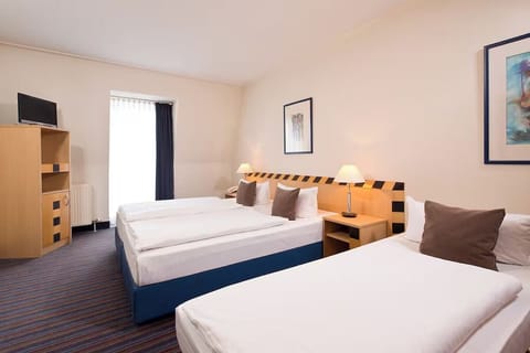 Sink into crisp beds and enjoy a calm, roomy stay.