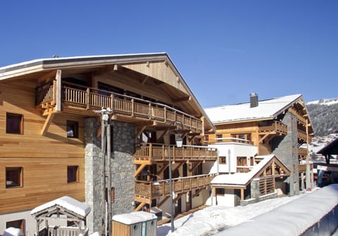 Built in traditional Savoyard stone and timber, the residence blends into Châtel village while keeping the slopes just steps away.