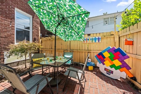 Set up on the back patio, throw something on the grill, and take on the giant Tetris. Fenced yard, string lights overhead — this is where evenings go.