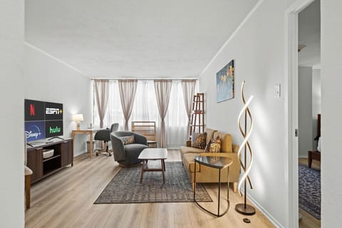 Relax on the cozy sofa and stream your favorites on the Smart TV. Open sightlines connect the living space to a bright work nook.