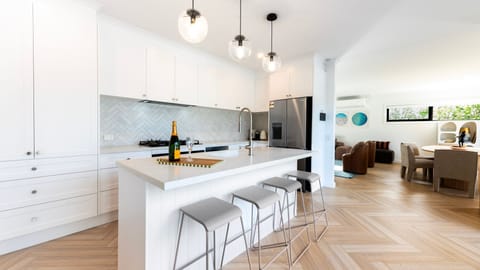 Prepare meals with ease in the fully equipped kitchen designed for convenience and functionality.