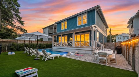 **Private pool backyard** After a day out, you can gather for a backyard cornhole match, then linger over dinner under the café lights as the pool shimmers beside you.