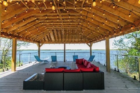 Stunning waterfront deck and gazebo overlooking Lake Dalrymple, perfect for sunsets, fishing, and lakeside relaxation.