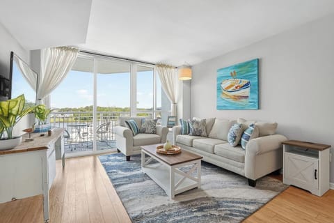 Open-concept living space with cozy seating and direct access to your private balcony. Enjoy the view.