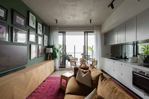 Pour a fresh morning coffee in the sleek modern kitchen, step through to the private balcony to soak in the light, and sink into the plush sofa after a day exploring the city.