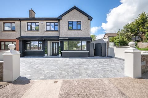 Front of house with 2 suv parking plus on street park