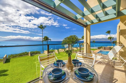 Unit 1: Lanai: Sip coffee or enjoy a sunset dinner from your private ratio over looking.