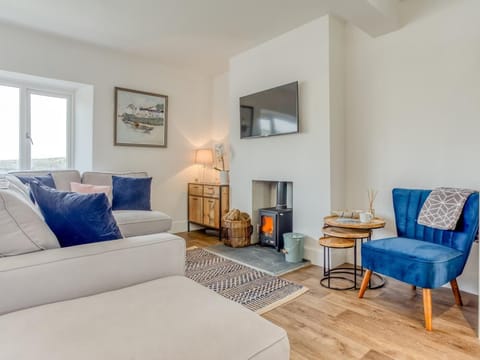 Relax by the woodburner in the living room
