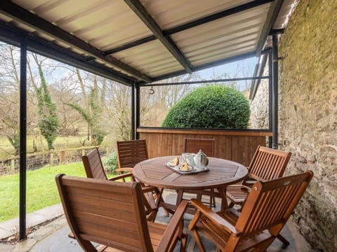 The covered patio allows for all weather al fresco dining