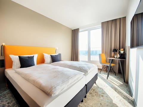 Wake up to sunlight streaming in by the balcony doors.