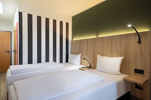 Drift off easily in crisp beds beneath warm, reading lights.