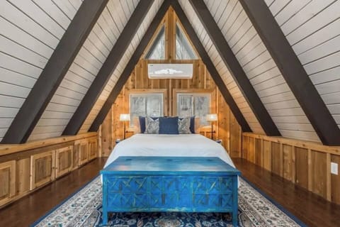 Top Floor Loft with Queen bed. Bedroom has a baby gate to block off spiral staircase. **This is an open air space and is not entirely private.**