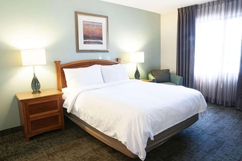 Sink into a cloud-soft king bed after busy days.