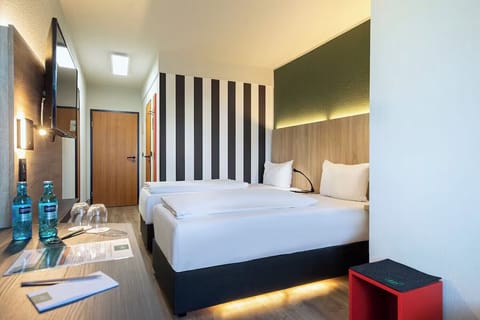 Recharge in a stylish room with soft lighting and clean lines.