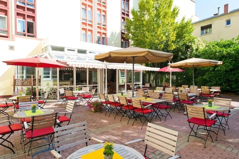 Gather together in a sunlit courtyard made for long conversations.