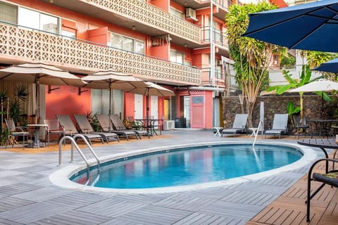 Stretch out poolside on loungers in a breezy courtyard setting.