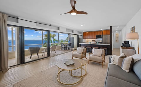Living room with incredible views and modern furnishings. Includes a queen sleeper sofa, ceiling fan, air conditioning, smart TV, and coffee bar!
