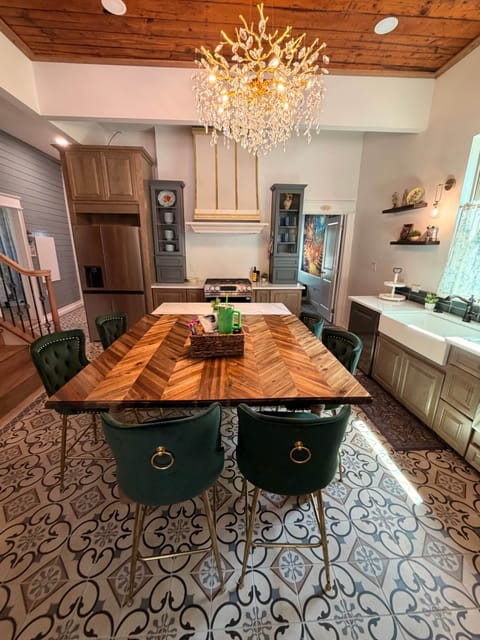 Chef kitchen with gas stove and large island seating