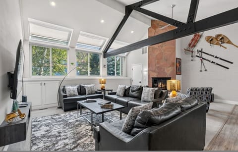 Spacious living room with vaulted ceilings and  smart TV