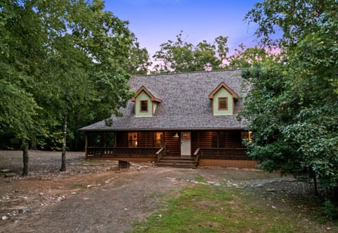 From the moment you arrive, you'll appreciate the quiet surroundings, spacious driveway, and inviting cabin exterior that set the tone for a relaxing stay.