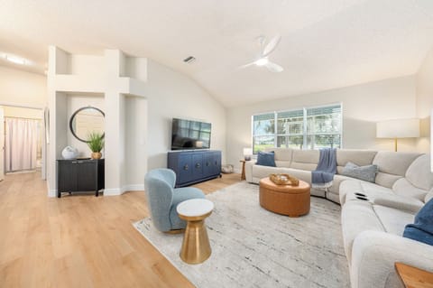Architectural Elegance with Soaring Ceilings & Golf Course Views!