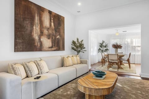 Unwind in the contemporary living area with plenty of natural light, perfect for gathering together or enjoying a quiet evening in.