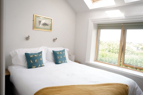 Bedroom with view and skylight. 