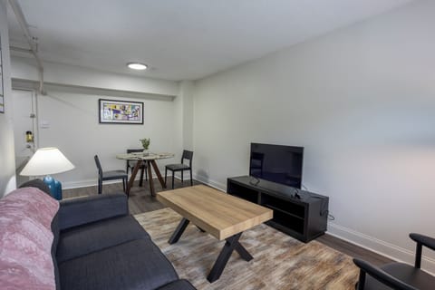 Cozy living room with TV and dining nook for relaxed stays