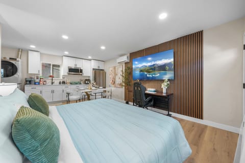 Relax in bed while enjoying your favorite shows on the smart TV.