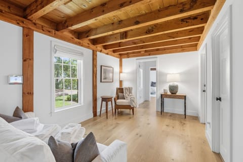 Bright rustic retreat with exposed beams and airy natural light