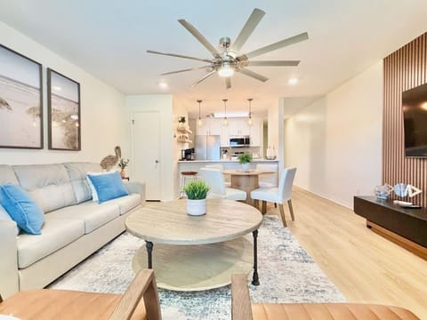 Living room upstairs, 65" tv wall dining table with 4 seats and 4 barstools