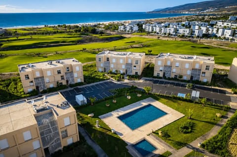 Coastal resort living with pool, golf views, and beach just moments away