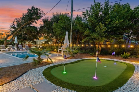 What backyard vacation dreams are made of - heated pool, light up putting green and tons of fun just steps from the ocean!
