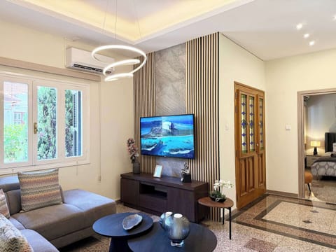 Relax in the bright and stylish open-plan living area, complete with a comfortable sofa, Smart TV, high-speed Wi-Fi, and plenty of natural light.