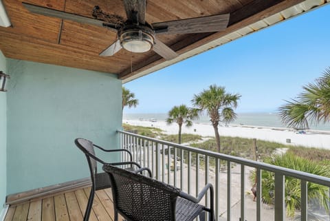 Sip your morning coffee on your private balcony overlooking white sand and swaying palms, with the Gulf's gentle waves just steps from your door.