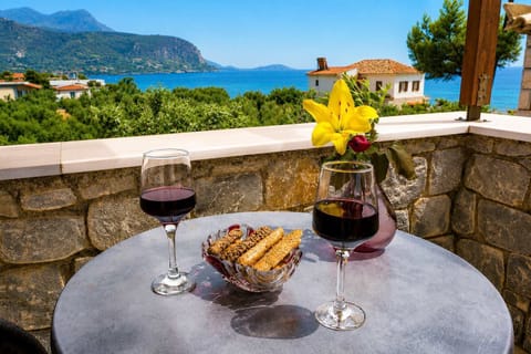 Enjoy breakfast on the private stone terrace with beautiful sea and mountain views.
