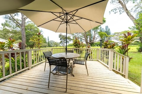 Unwind under the umbrella with breezy garden-view dining.
