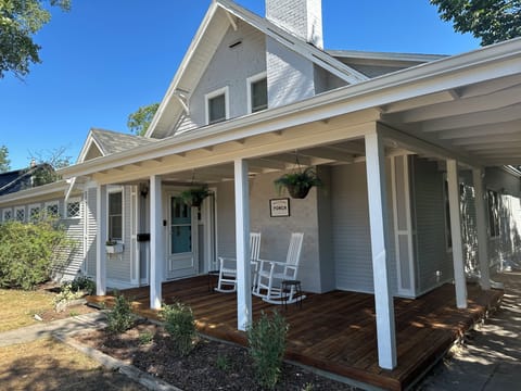 Charming cottage porch with rocking chairs and inviting curb appeal