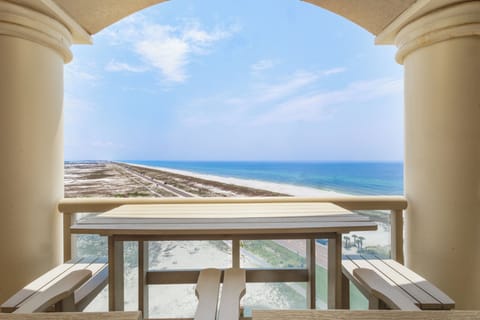 Step out onto your private balcony and take in sweeping views of pristine white sand and endless turquoise waters stretching to the horizon.