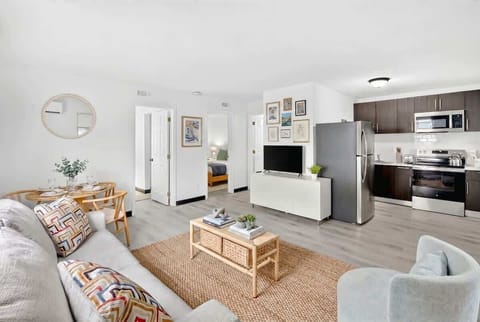 Make yourself at home in the welcoming living room, complete with comfortable seating and a Smart TV.