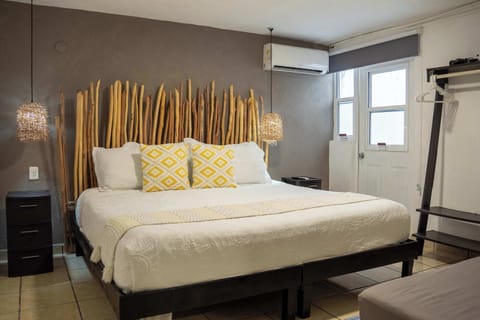 Comfortable studio bedroom with a king bed and cool A/C, a restful base in downtown Cancun