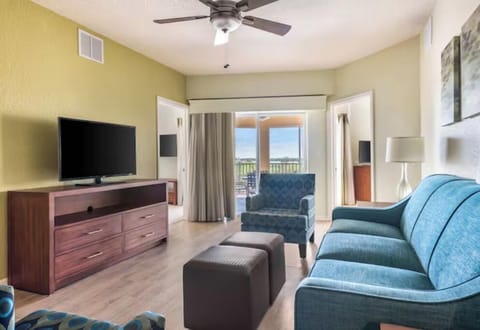 Sip morning coffee beside sunny balcony doors and cozy seating.